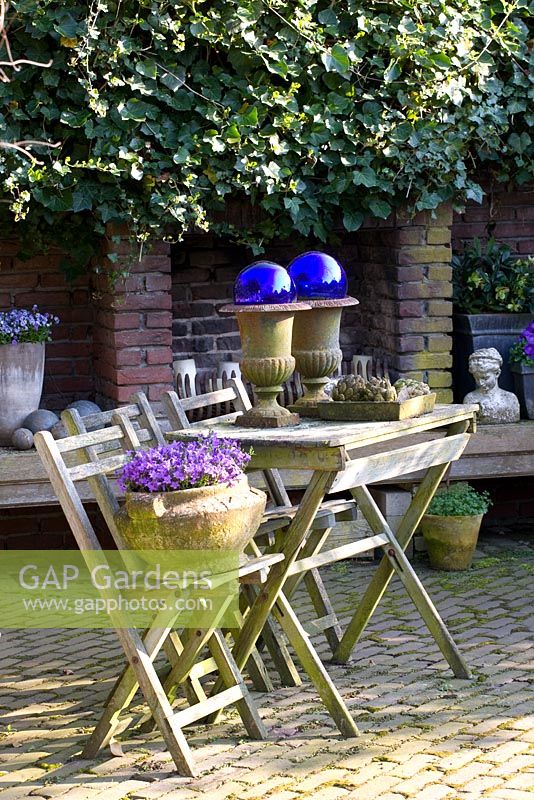 Courtyard garden with furniture and ornaments