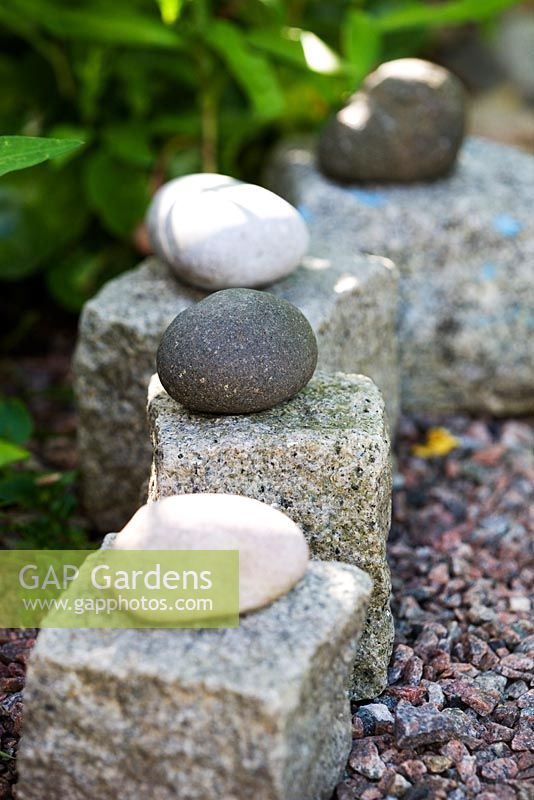 Cobble stones and pebbles edging a gravel path