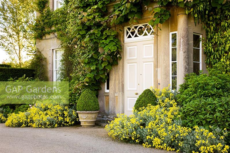 The North East Front of Highgrove House, with pots and flowers, June 2008. The house built between 1796 and 1798 in georgian neo - classical design. 