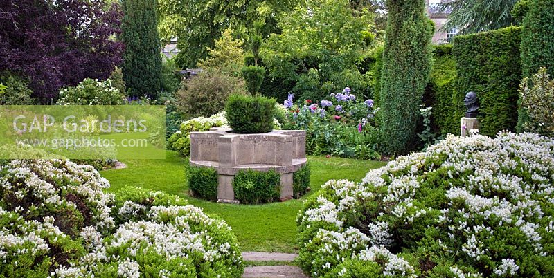 The Cottage Garden with circular stone seat, Highgrove Garden, June 2011. 