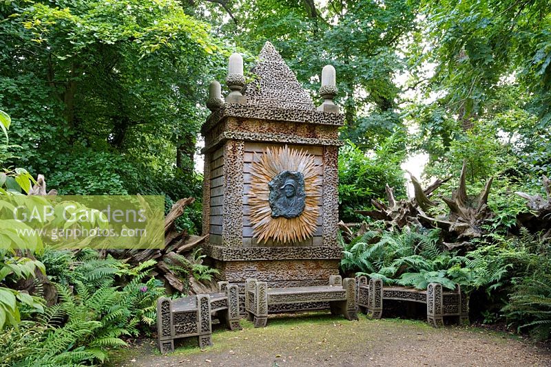 The Temple of Worthies in the Stumpery with a bronze relief of The Queen Mother in the centre. Highgrove Garden, August 2007. 