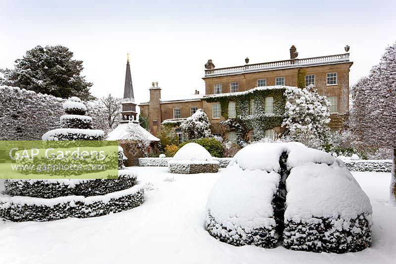 The west front from The Thyme Walk with the Oak Pavillion, covered in snow, Highgrove Garden, January 2010.
