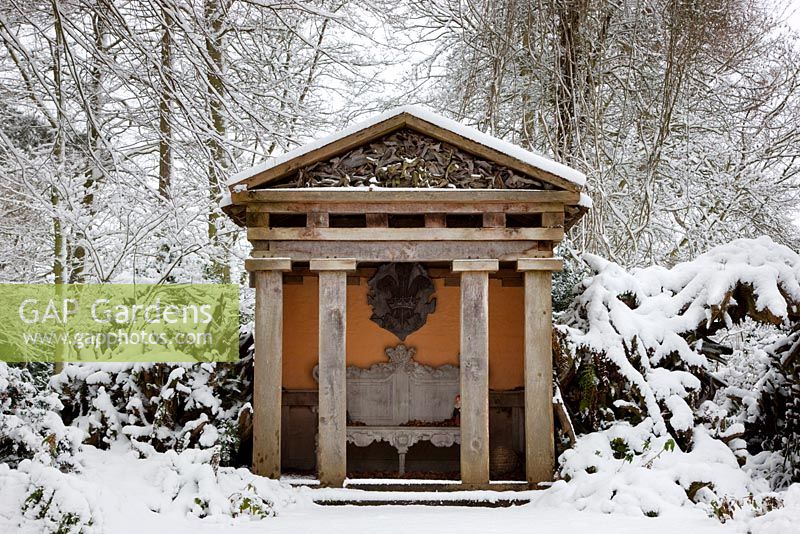 Temple in the the Stumpery made of green oak in snow, Highgrove Garden, January 2010. 