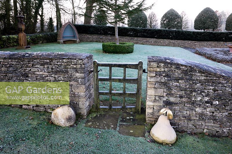 The Gate from The Orchard Room with gold coloured Apple and Pear sculptures, Highgrove Garden, December 2008. 