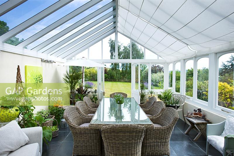 Conservatory with wicker table and chairs