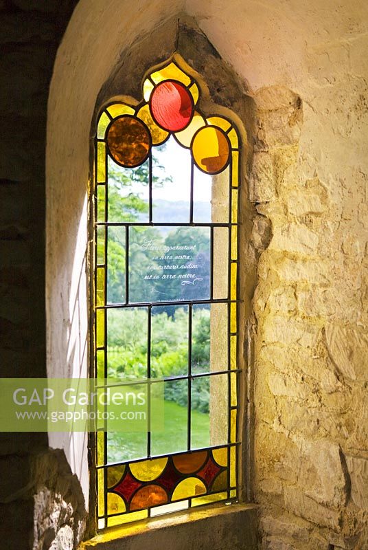 Stained glass in a window in the red house. Painswick Rococo Garden, Gloucestershire 