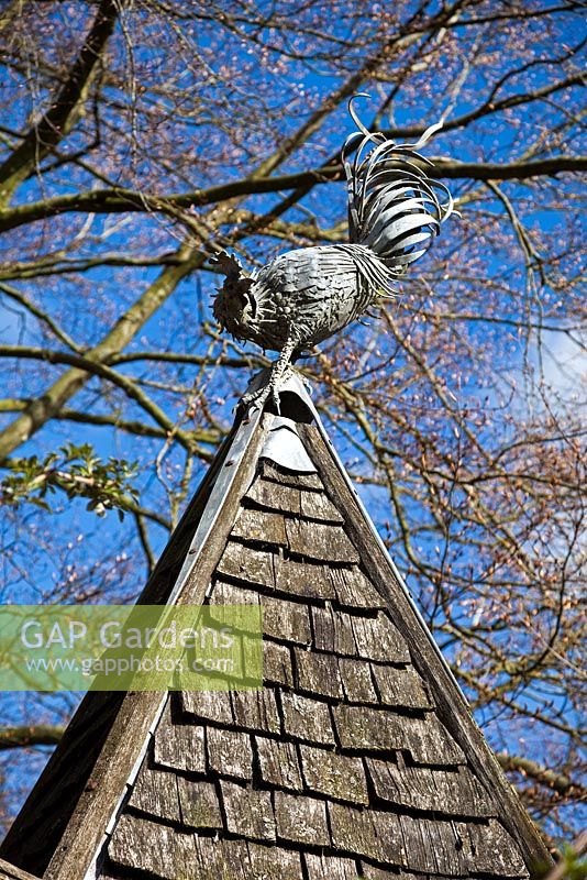 Steel cockerel finial on the top of the Gothic Chicken House,  Highgrove April 2013.