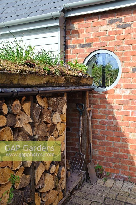 Log store with green roof