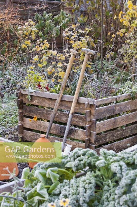 Compost heap with tools.