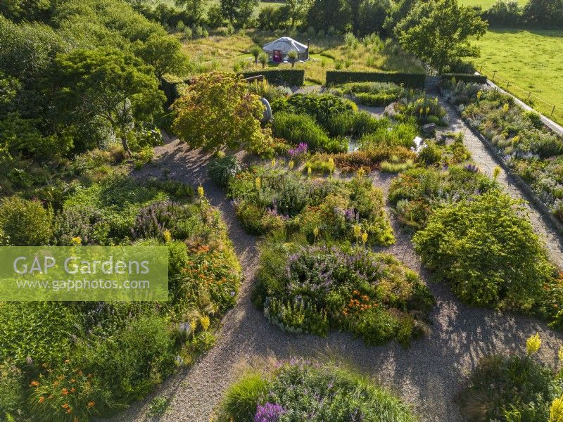 Aerial view, Summer in a gravel garden, with drifts of perennials and winding gravel paths