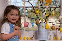Little girl with her easter tree at Easter