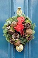 Christmas Wreath on blue front door of Georgian house in Highbury, London, UK