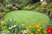 Circular lawn surrounded by flowerbeds 
