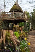 The thatch tree house 'Hollyrood House', The Stumpery, Highgrove Garden, March 2011. The Stumpery is based on a Victorian concept for growing ferns amongst tree stumps.  