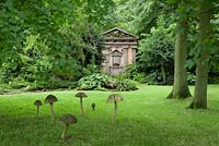 Green Oak Temple and giant wooden mushrooms in the Stumpery.  Highgrove Garden, August 2007.  