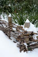 Woven hurdle with snow