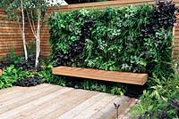 Vertical living wall above a cedar wood bench - Escape To The City - RHS Tatton Park Flower Show 2013