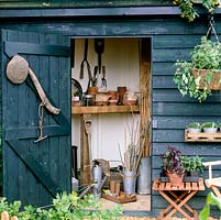 Tool shed in corner of kitchen garden.
