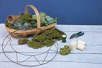 Materials required are Moss, Succulents, Peat free fibre pots, Secateurs, Candles, Wreath frame, Florist wire and some thick string