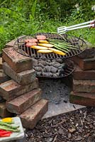 Grilling fresh vegetables on a homemade barbecue