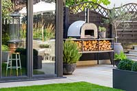 Modern patio with view to Pizza oven. 