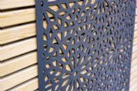 Wooden trellis with decorative panel 