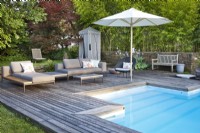 Relaxing area on decking by the swimming pool.