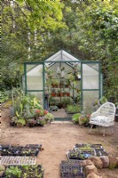 Greenhouse with seedlings in foreground