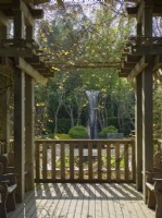 Fountain - view through wooden pergola