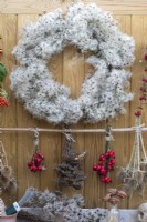 A wire wreath frame is wrapped in dried old man's beard, foraged from hedgerows and woodland along with teasels, rose hips and dried yarrow flowerheads.