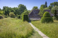Looking over the topiary meadow towards the hovel in mid summer