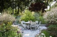 Seating area in a country garden in July
