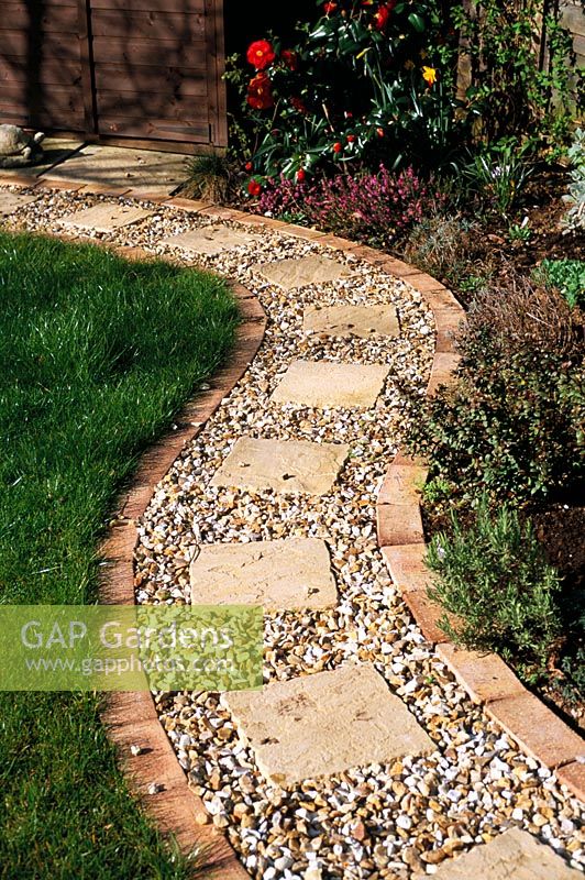 Gravel Path with brick edging and square slab inlays