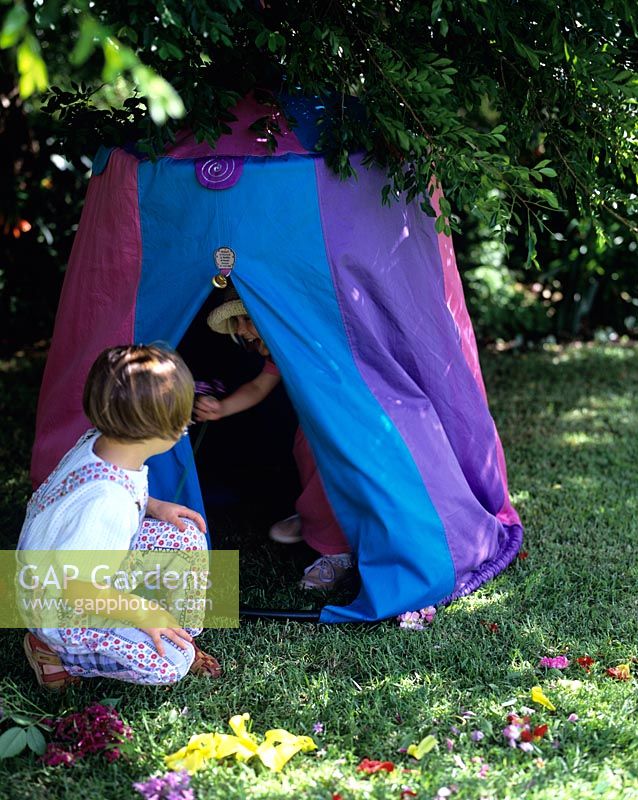 Girls playing in their tent