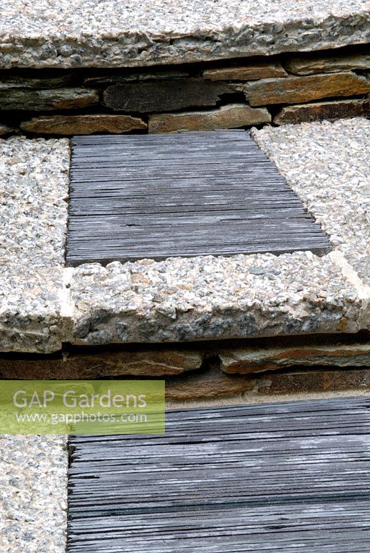 Steps made from granite chippings with slate insets on each tread