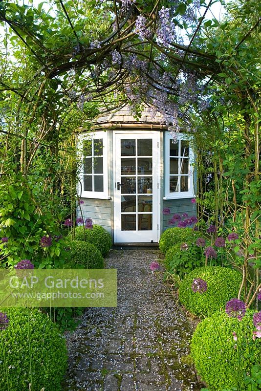 Summerhouse and pergola in small contemporary cottage garden in early summer - Bullock Horn Cottage, Wilts
