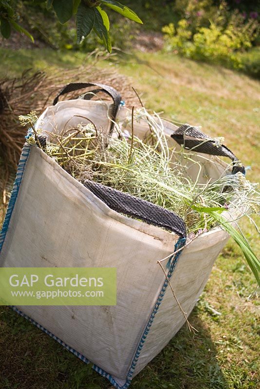 Large rubble sack used as garden tidy.