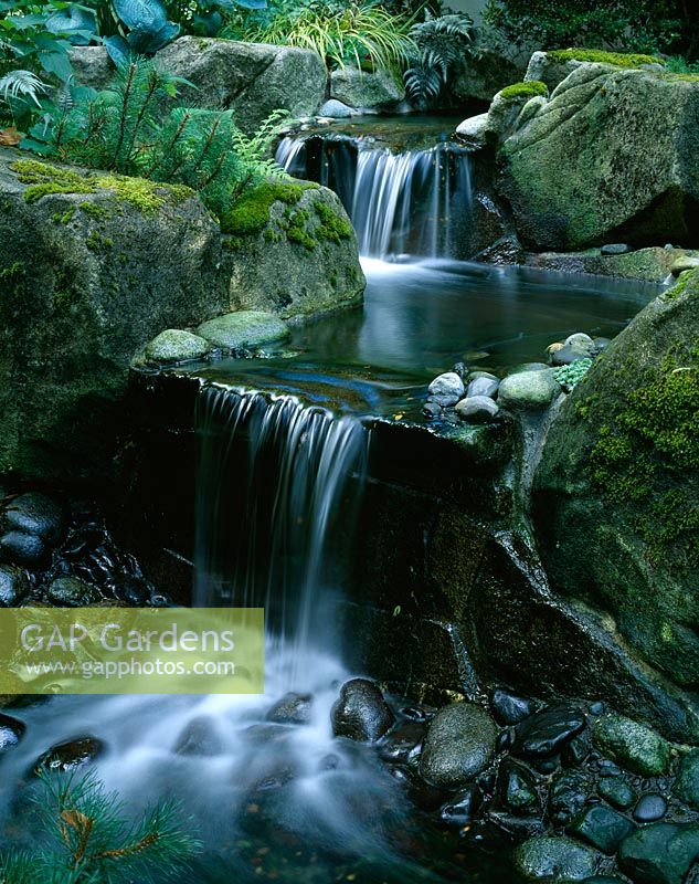 Waterfall in woodland garden