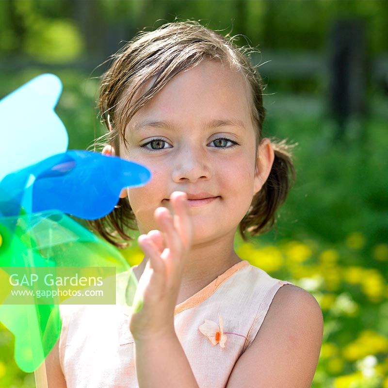 Girl playing with windmill