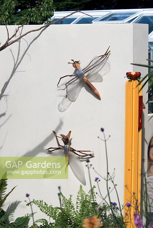 Ornamental Dragon flies on wall - Hampton Court 2007