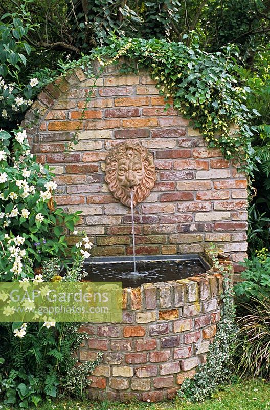 A running water feature with an ornamental Lion's head