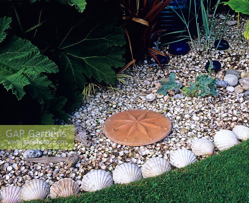Seaside garden edging with shells