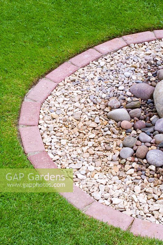 Lawn with brick edging, gravel and pebbles - Nailsea, Somerset, UK 