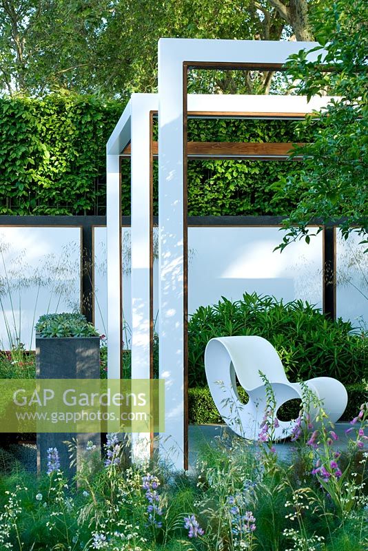 White frames with white bench in The Savills Garden, Design - Philip Nixon, Sponsor - Savills PLC, RHS Chelsea Flower Show 2008, Gold medal Winner