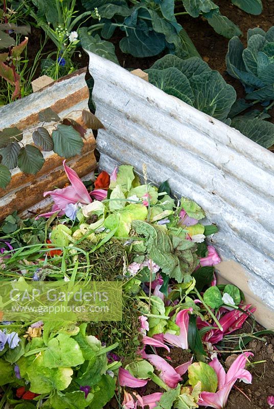 Compost area in the vegetable garden at Mundy's Cottage Garden in The Daily Mail Pavilion at the RHS Hampton Court Flower Show