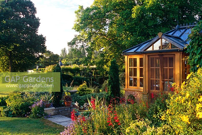 Summerhouse amongst conifers and Penstemon - Cedar Farm, Desborough, Northants