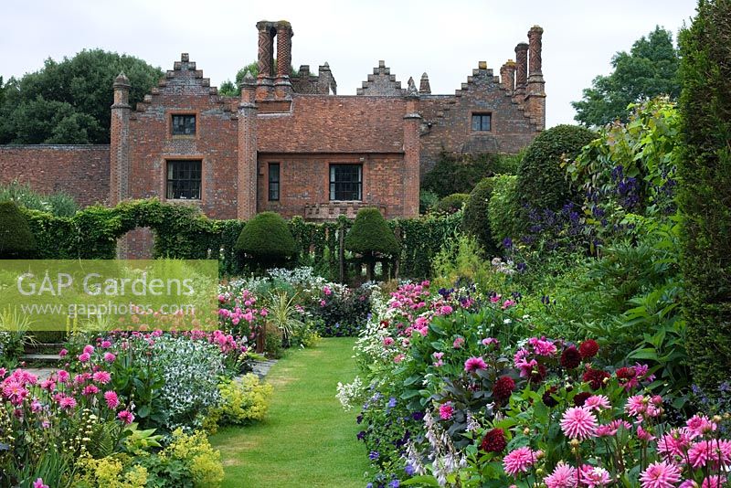 Chenies Manor Gardens showing the 'Sunken Garden' and house with it's distinctive chimneys