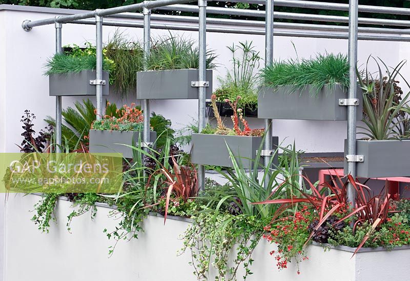 Aerial steel planters supported on poles around the edge of roof terrace - Design - Foundation Degree Course and Landscape Design Students (Year 3) Warwickshire College - RHS Hampton Court Palace Flower Show - Bronze medal