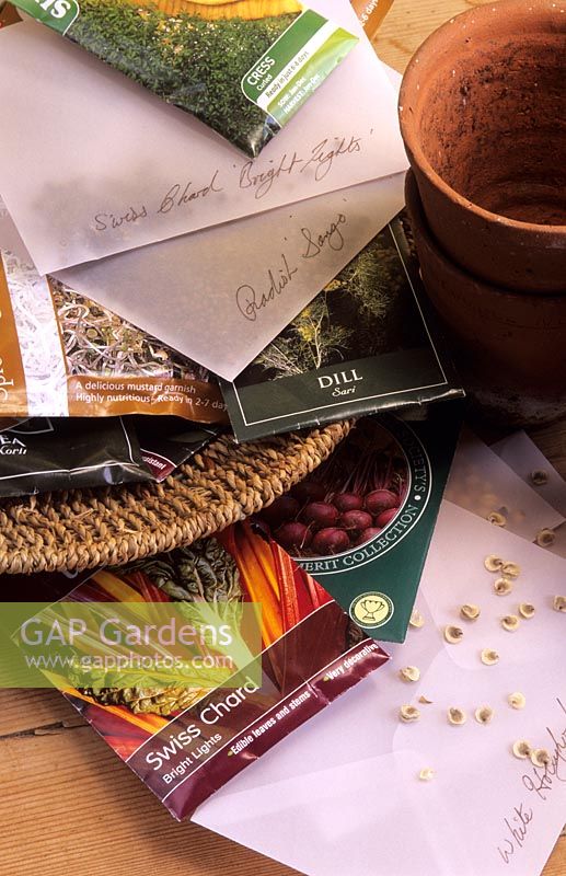 Selection of garden seed packets on potting bench