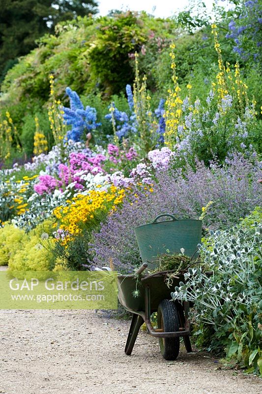 Weeding the herbaceous border at Waterperry gardens, Oxfordshire